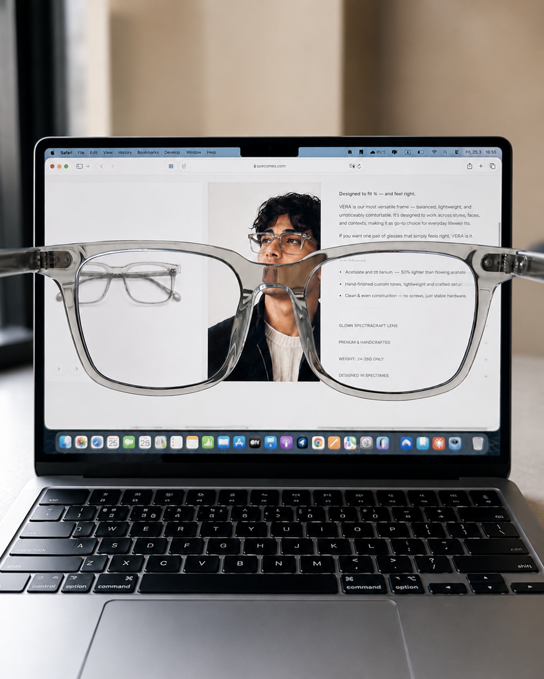 Laptop with blue light glasses on top displaying a webpage with an article and clear display.