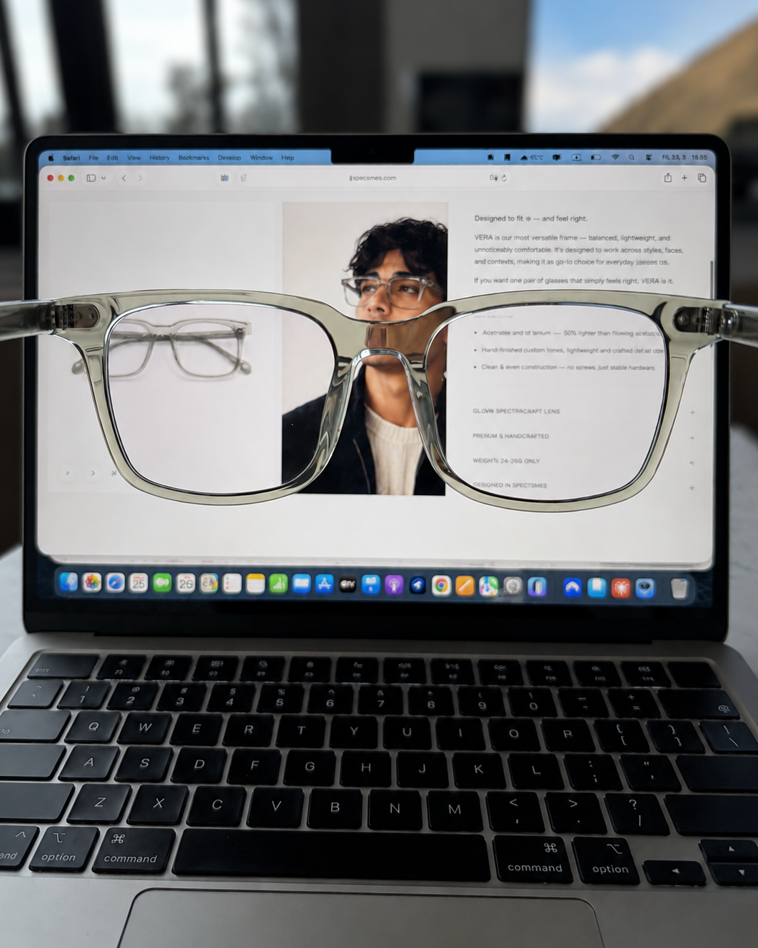 Laptop displaying an image of a person wearing Blue light glasses without yellow tint with a blurred background