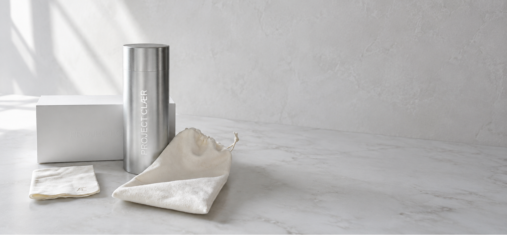 PROJECT CLÆR packaging with aluminium tube, glasses, pouch and microfibre cloth